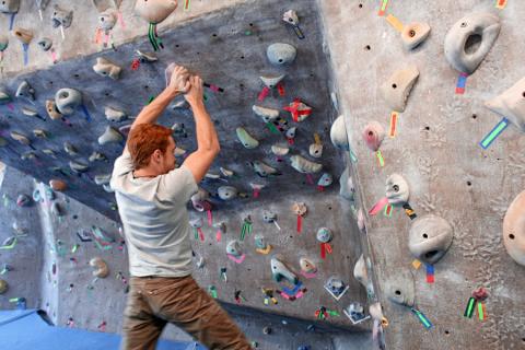 student on the climbing wall