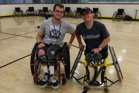Student wheelchair users posing on basketball court