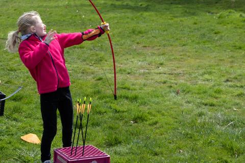 Child using archery bow