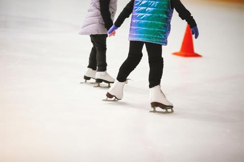 Two children ice skating